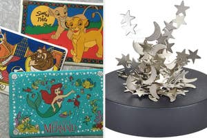 Three wallets featuring characters from Disney's The Lion King, Beauty and the Beast, and The Little Mermaid beside a sculpture with crescent moons and stars