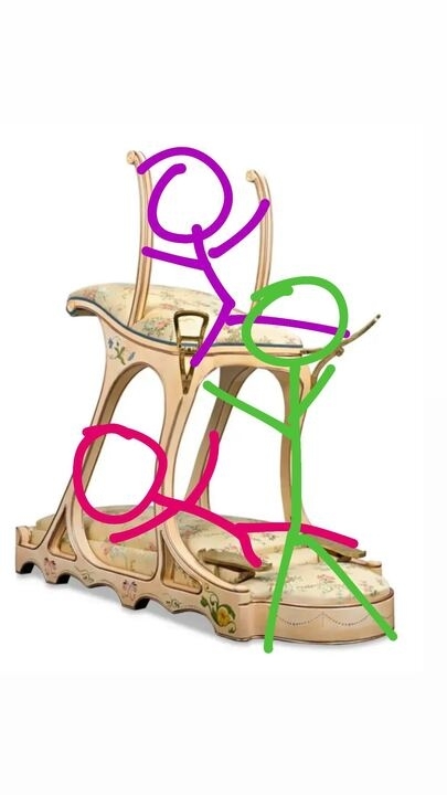 Intricately designed high-heeled shoes decorated with a floral pattern and surrounded by colorful stick figure drawings