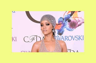 Rihanna at the CFDA Awards in a sparkling, sheer gown and headwrap, posing with a serious expression in front of a backdrop with logos
