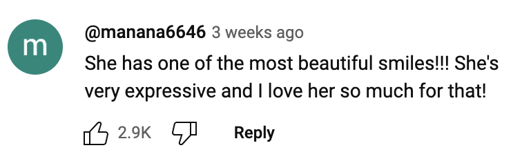 A social media comment by @manana6646 saying: "She has one of the most beautiful smiles!!! She's very expressive and I love her so much for that!" The comment has 2.9K likes