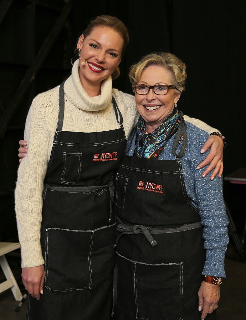 Katherine Heigl and her mother, Nancy Heigl, both in aprons at the NYCWFF event, smiling and posing together