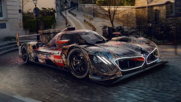 A sleek, futuristic race car parked on a cobblestone street, showcasing its aerodynamic design and intricate detailing