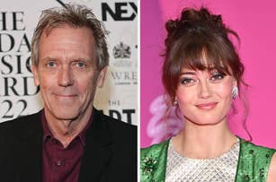 Hugh Laurie in a suit and Madalina Ghenea in a sleeveless dress at an event