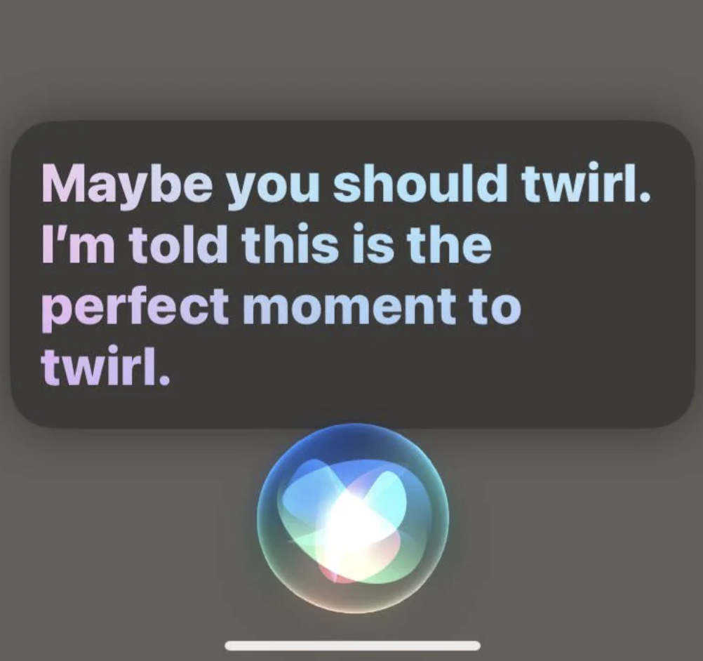 A Siri prompt says, "Maybe you should twirl. I'm told this is the perfect moment to twirl."
