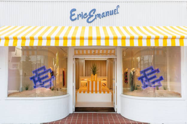 Front view of the Eric Emanuel store with a yellow and white striped awning, neon EE signs in the windows, and clothing displayed inside