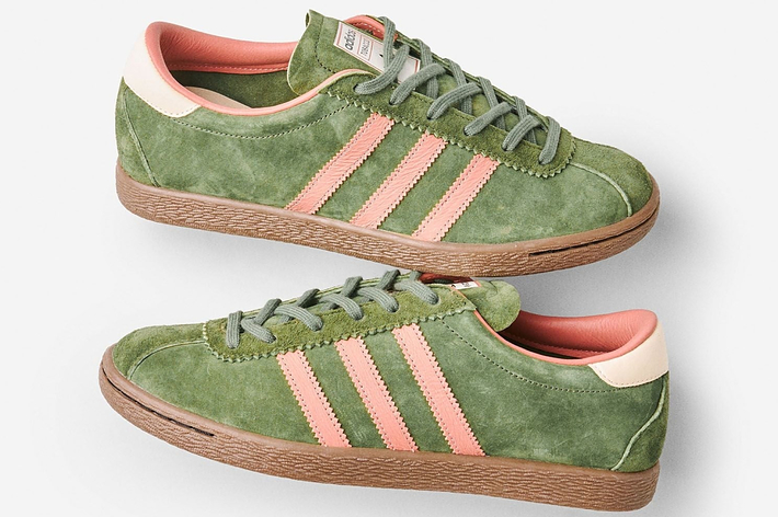 Green Adidas Gazelle sneakers with pink stripes and beige accents, viewed from the side and top-angle positions