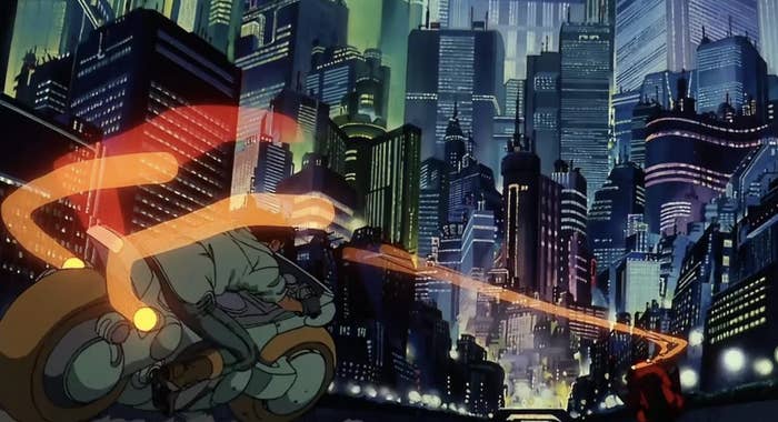 Neo-Tokyo city scene from Akira featuring Kaneda on his motorcycle, speeding through the futuristic cityscape with light trails behind him