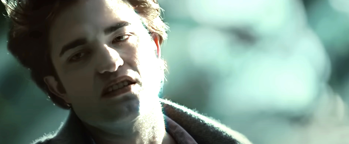 Robert Pattinson in a scene from the TV show or movie, appearing in character with a serious expression