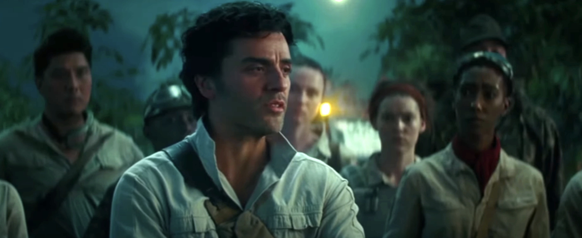Oscar Isaac as Poe Dameron leads a group through a forest in a scene from a movie