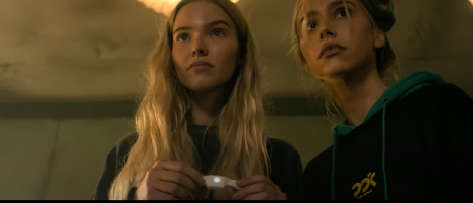 Sasha Luss and Alexis Ren look up and concerned