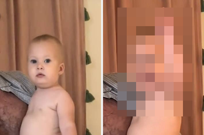 Adult holding a baby in a diaper, with a young child raising their arms in excitement nearby