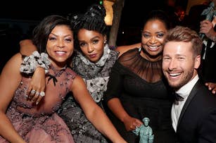 Taraji P. Henson, Janelle Monáe, Octavia Spencer, and Glen Powell celebrate at an event, holding a statuette. They are dressed in elegant evening attire
