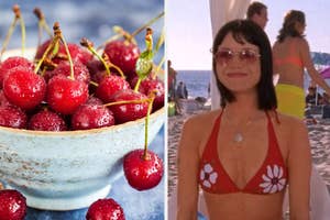 A bowl of cherries next to a beach scene with a person in a red bikini with white flowers on it