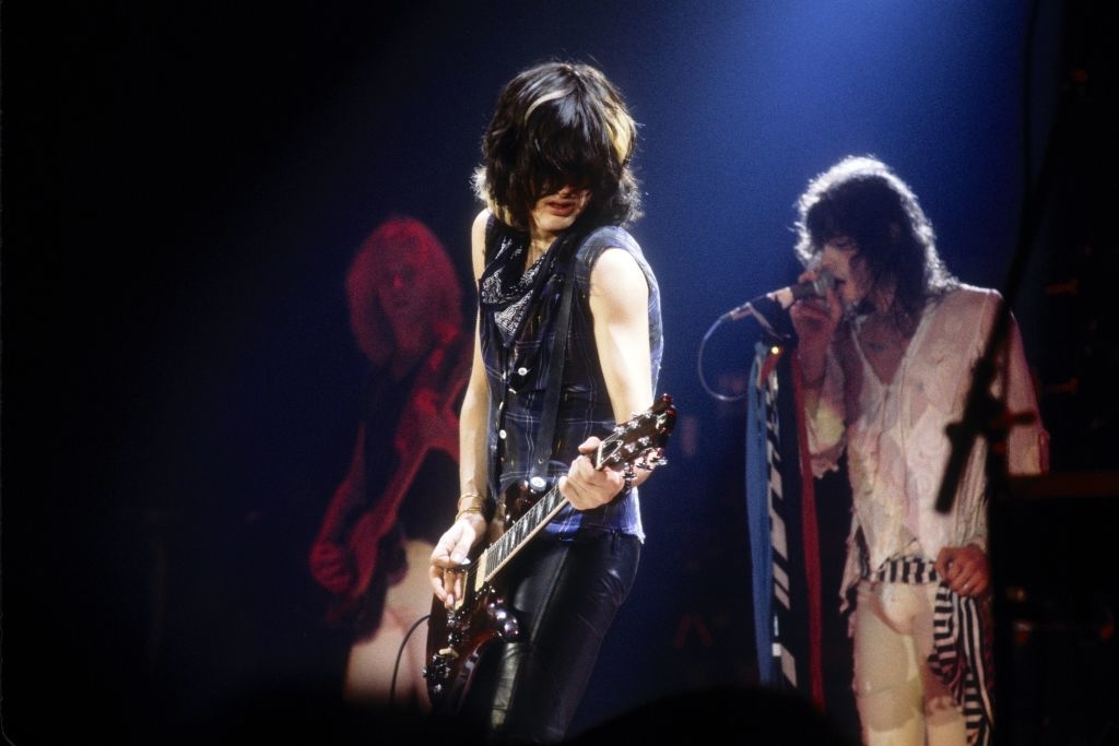 Aerosmith members performing onstage