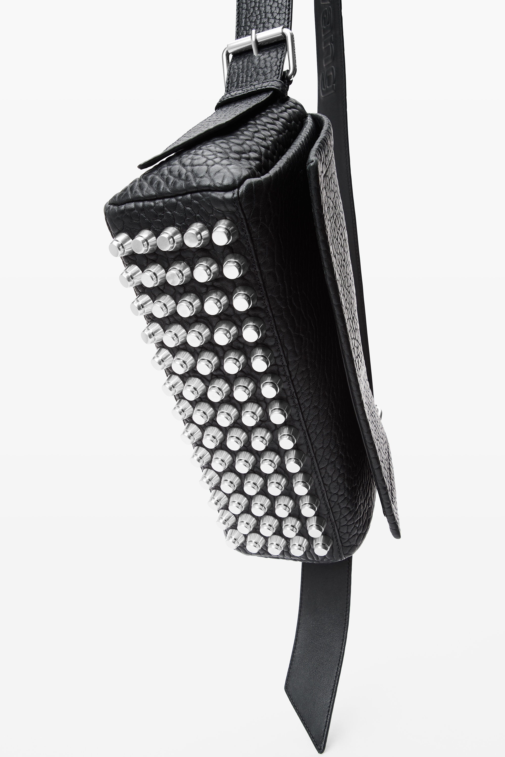A black textured crossbody bag adorned with multiple rows of silver studs