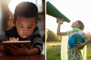 A boy is focused on a tablet. A girl holds a green megaphone and a globe, wearing a green cape outdoors