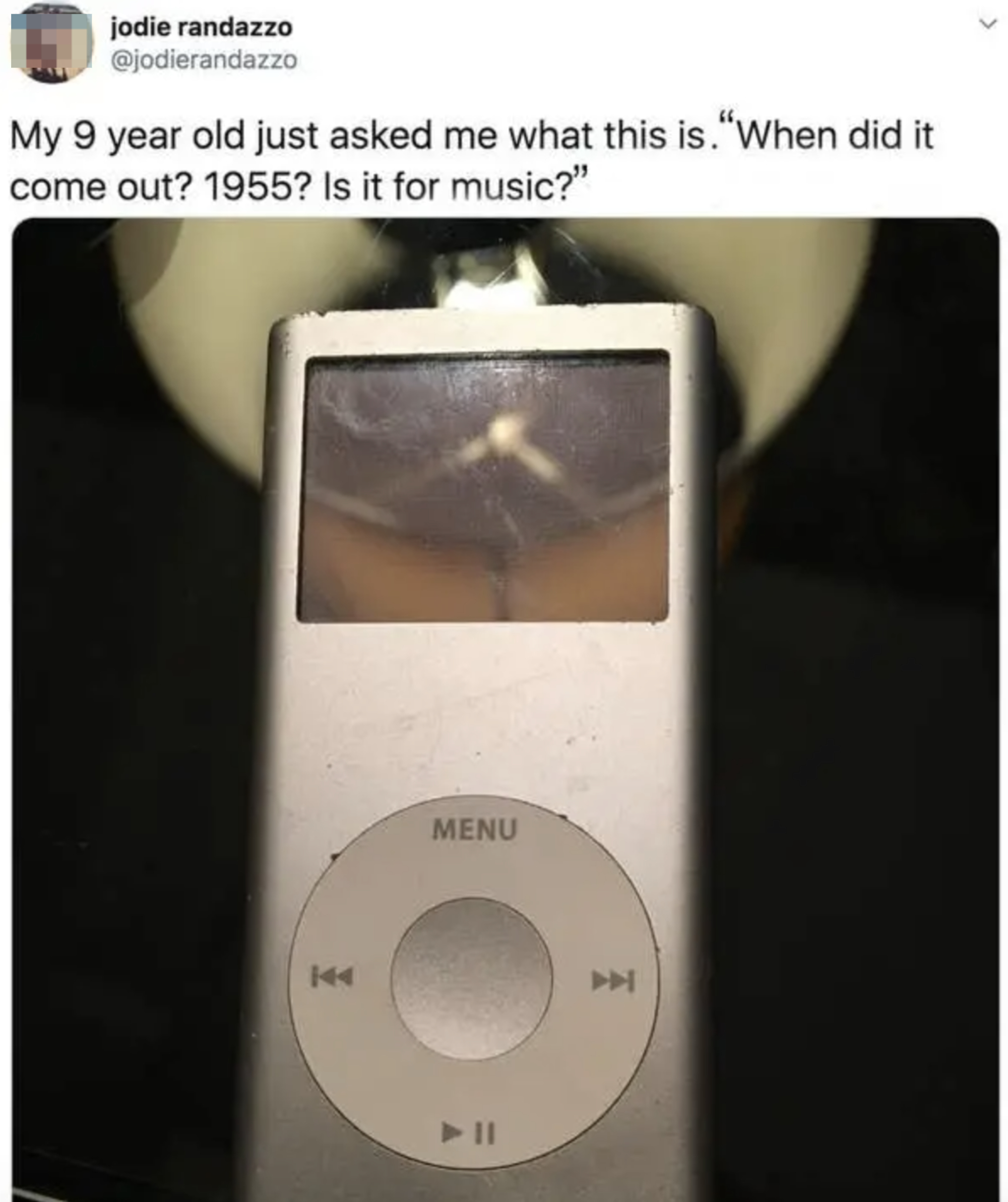 Close-up of an iPod Nano with text: &quot;My 9 year old just asked me what this is. 'When did it come out? 1955? Is it for music?'&quot; tweeted by Jodie Randazzo