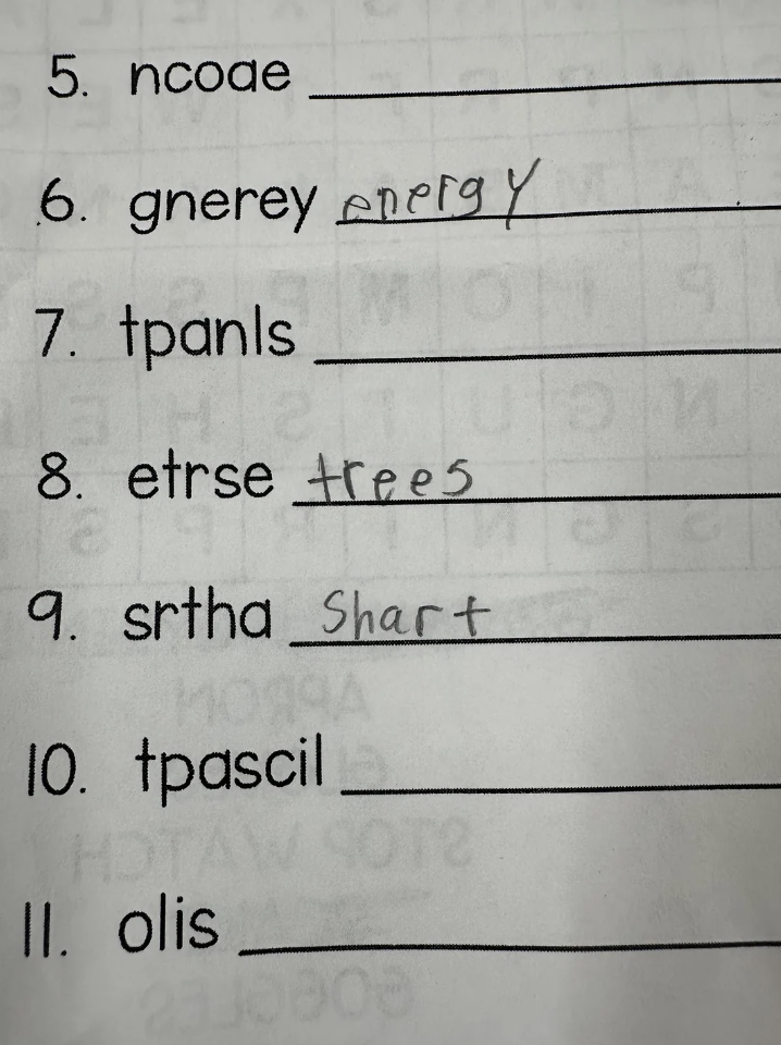 A worksheet with scrambled words and handwritten corrections: ncafoe; gnerey (energy); tpanls; etrse (trees); srtha (shart); tpascil; olis