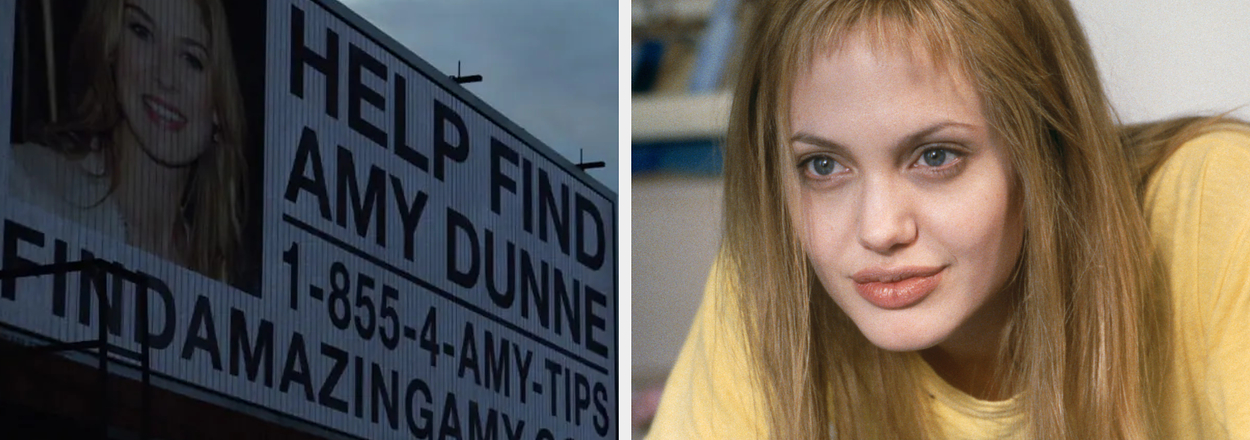 Billboard reads "Help Find Amy Dunne, 1-855-4-AMY-TIPS, FindAmazingAmy.com." Next to it, a woman in a casual yellow T-shirt is leaning forward