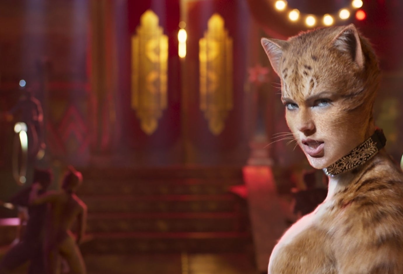 Scene from &#x27;Cats&#x27; with CGI-animated humanoid cat characters in a theatrical setting