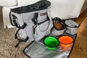 Pet travel bag set with various compartments and collapsible bowls
