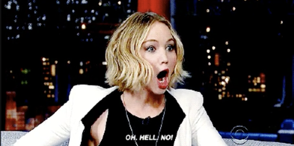 Jennifer Lawrence appears surprised during a talk show interview, mouth open, with caption &quot;OH. HELL. NO!&quot;