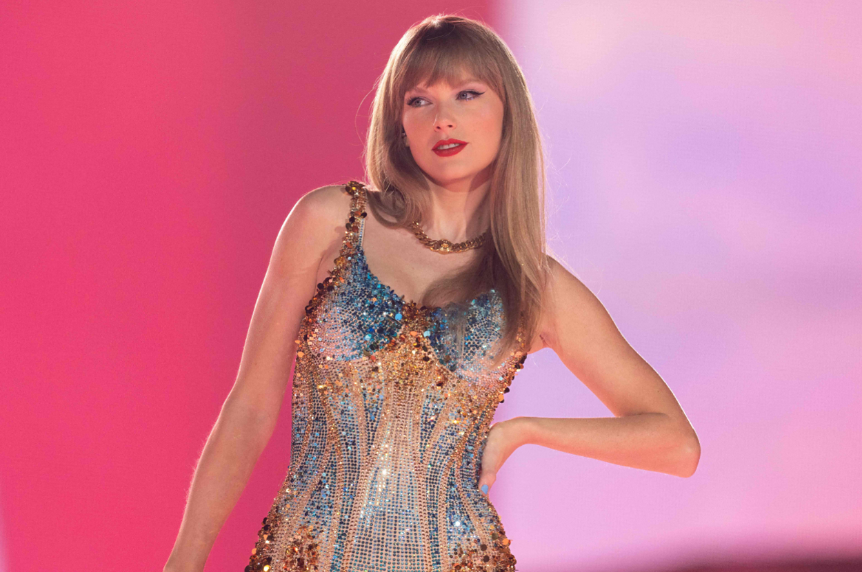 Taylor Swift on stage wearing a sparkly bodysuit