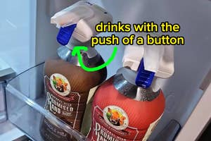 a reviewer's drinks in their fridge door with the dispensers attached "drinks with the push of a button"