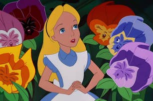 Alice from "Alice in Wonderland" surrounded by oversized, colorful flowers