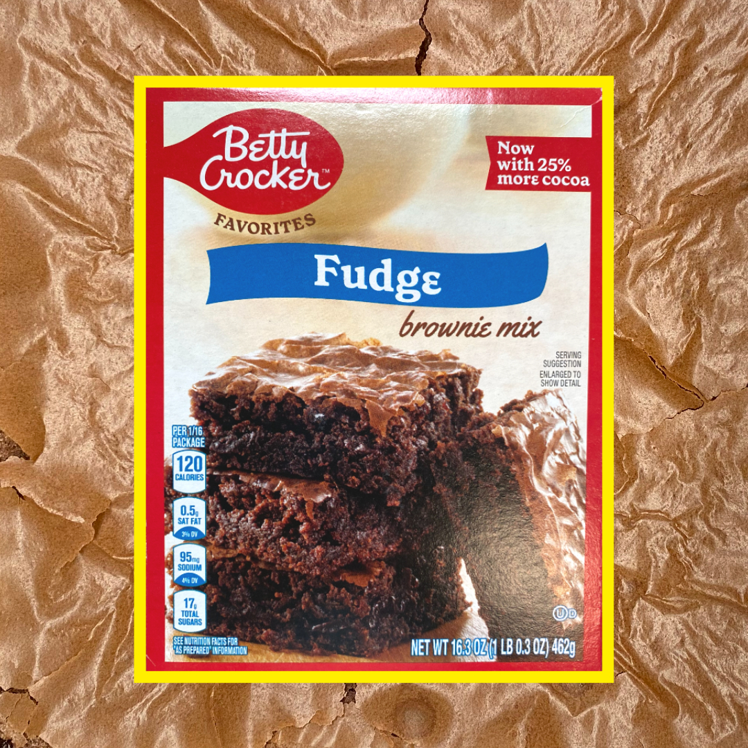 Betty Crocker Fudge brownie mix box overlayed over an image of baked Betty Crocker brownies