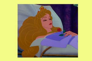 Princess Aurora from Sleeping Beauty lies asleep with a rose on her chest