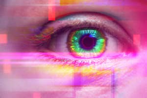 Close-up of a human eye with a digitally added colorful, glitch art effect