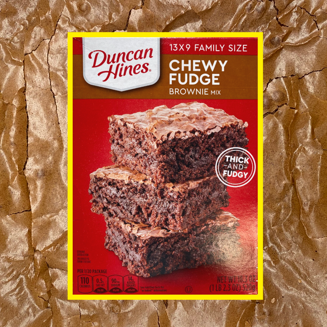Box of Duncan Hines Chewy Fudge Brownie Mix overlayed over an image of baked brownies