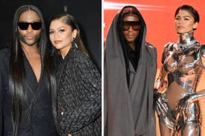 Two individuals posing, one in a metallic structured outfit, the other in black with a hood. They're at a celebrity event