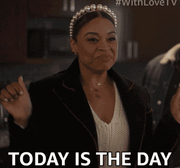 gif of a Woman in pearl headband and coat gestures excitedly with text &quot;TODAY IS THE DAY.&quot;