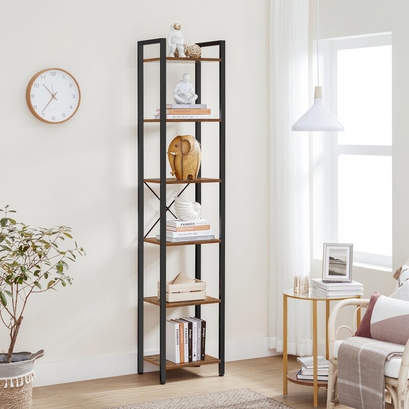 Five-tiered shelving unit with various decorative items and books in a living room setting