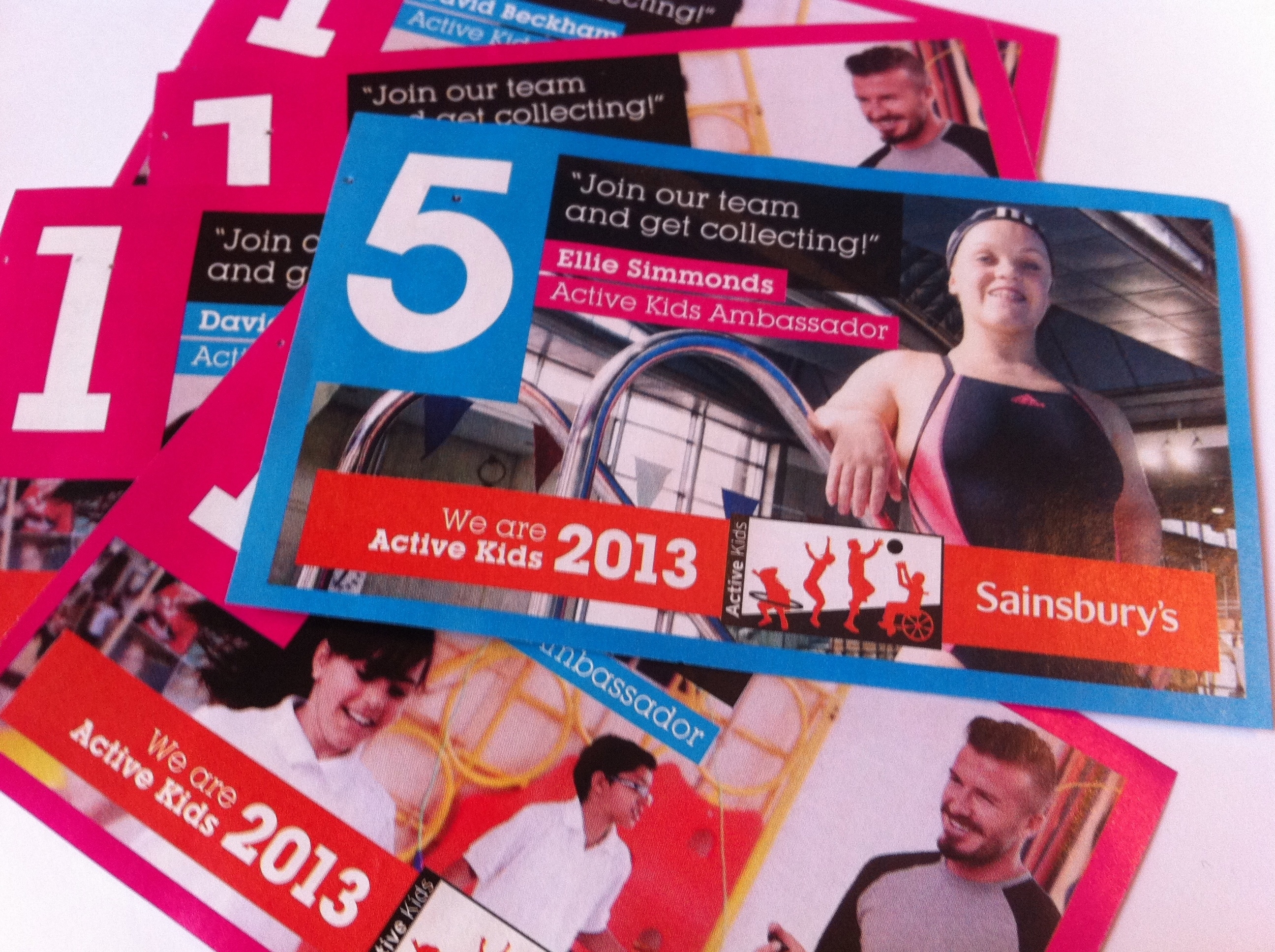 Several promotional cards featuring Ellie Simmonds as Active Kids Ambassador for Sainsbury's in 2013. David Beckham appears in the background