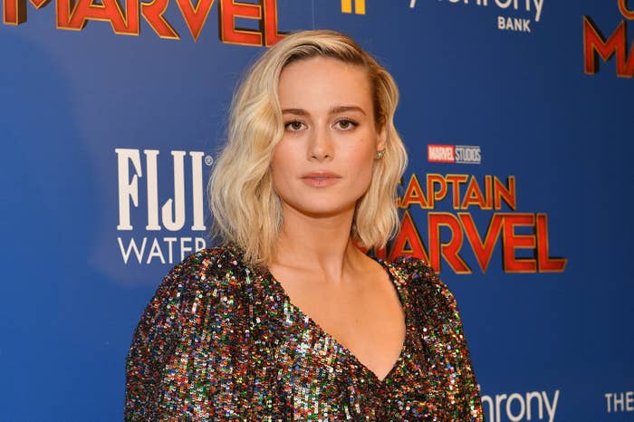 Brie Larson attends the Captain Marvel premiere in a sequined dress with a deep V-neckline