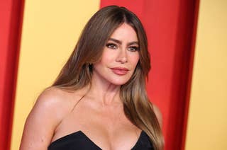 Sofía Vergara at a red carpet event, wearing a strapless black gown