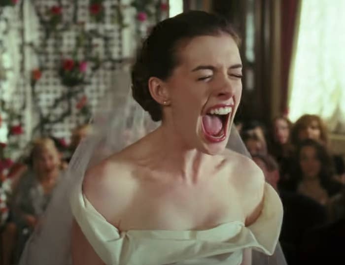 Anne Hathaway, dressed successful  a wedding gown, is shouting with her rima  wide   unfastened  successful  &quot;Bride Wars&quot;