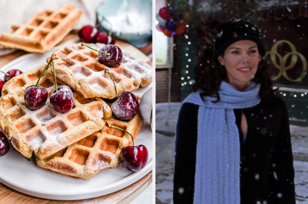 Waffles topped with cherries on a plate. On the right, a woman stands in the snow wearing a black coat, blue scarf, and black hat