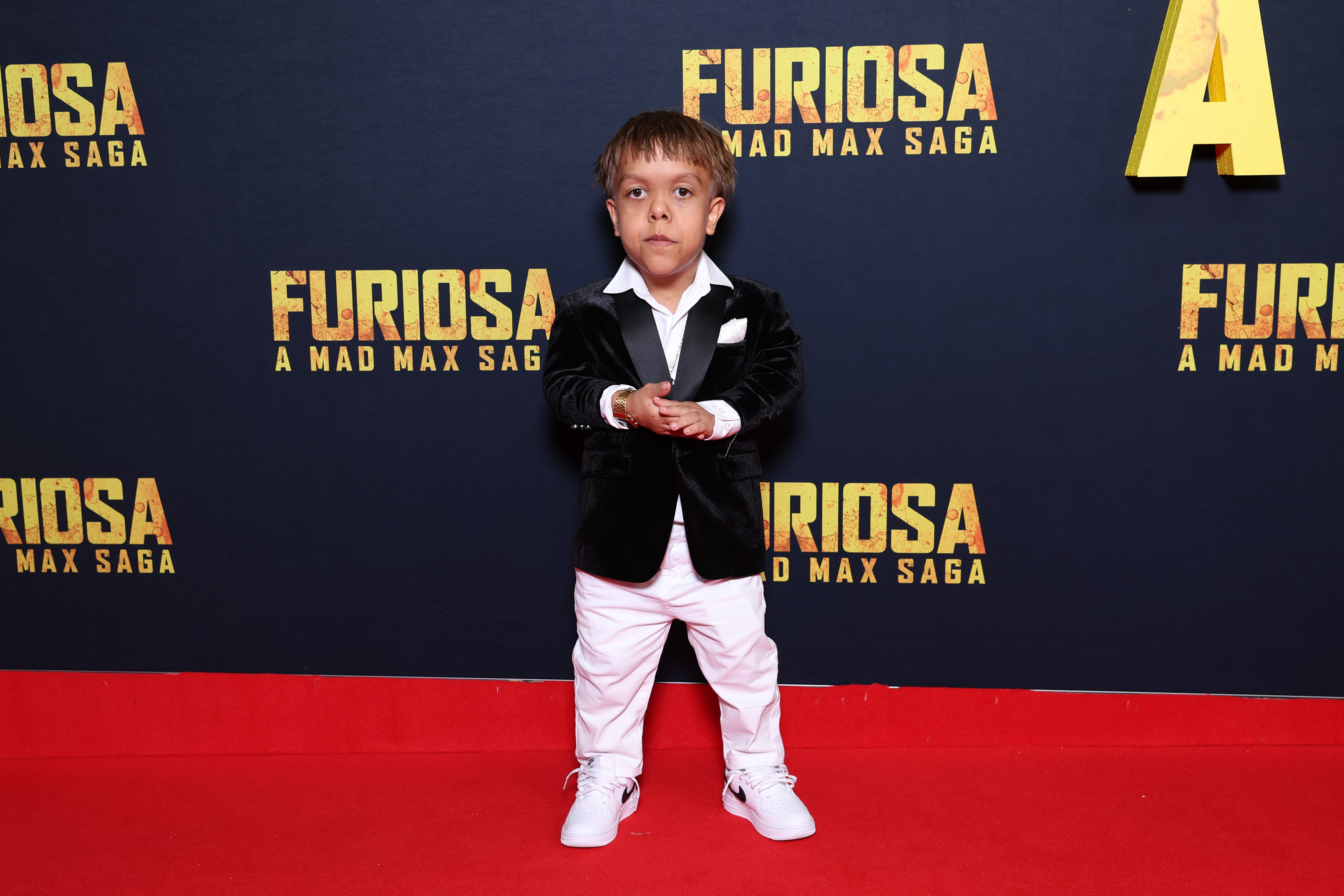 Quaden Bayles wearing a black-and-white tux at the Australian premiere of "Furiosa: A Mad Max Saga"