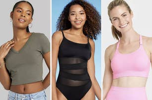 Three women model different styles of activewear tops: a grey V-neck crop top, a black mesh panel one-piece swimsuit, and a pink sports bra
