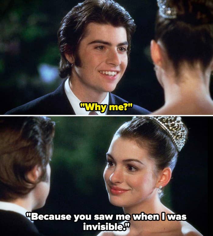 Anne Hathaway, wearing a tiara and formal dress, smiles at Robert Schwartzman in a scene from a movie, with both characters dressed in formal attire