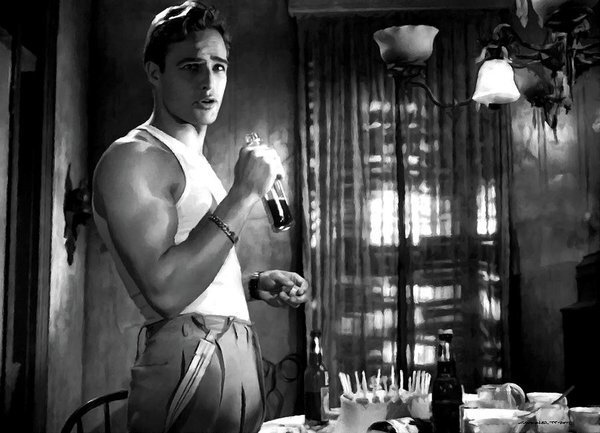 A person stands in a dimly lit room, holding a soda bottle and wearing a sleeveless undershirt and high-waisted pants. The table in front has various dining items