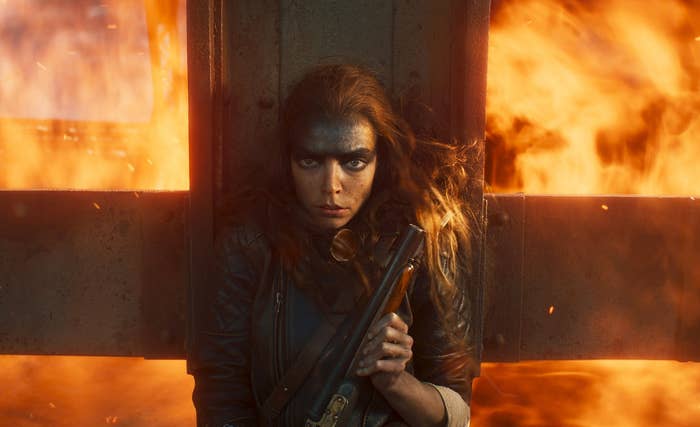 Anya Taylor-Joy surrounded by flames in a scene from "Furiosa: A Mad Max Saga"