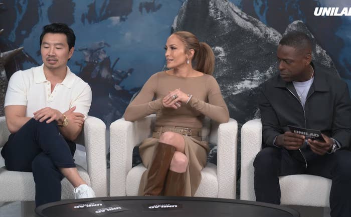 Jennifer Lopez, Simu Liu, and Sterling K. Brown sit on a panel discussing survival against the unknowns of robots and artificial intelligence