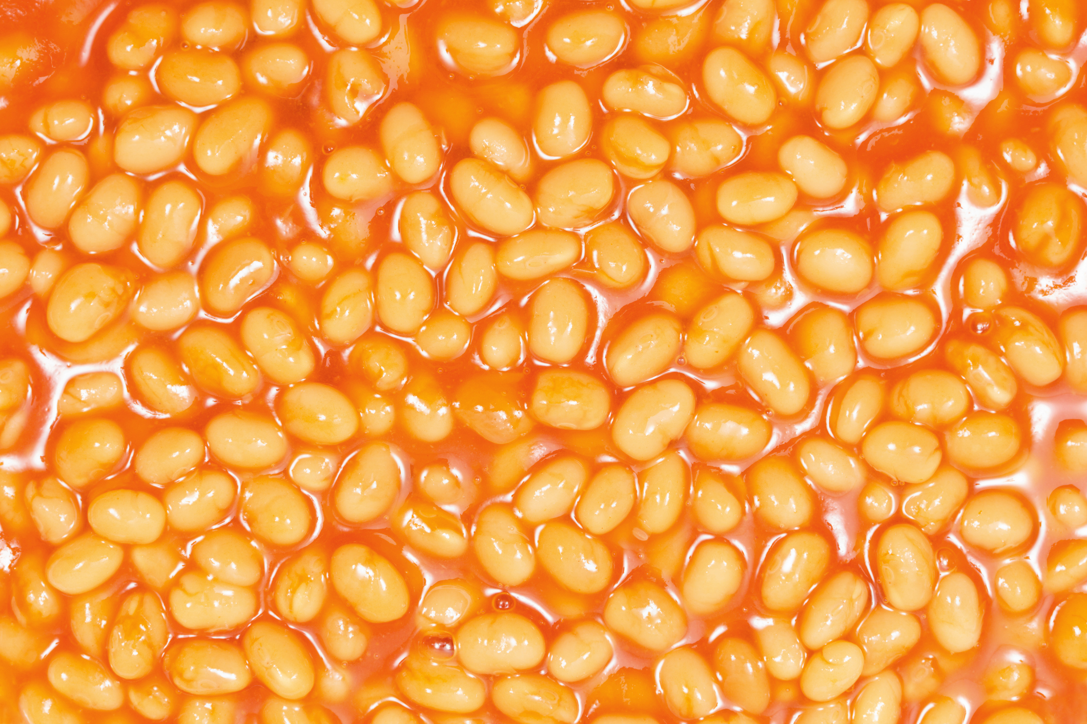 A close-up view of baked beans in tomato sauce