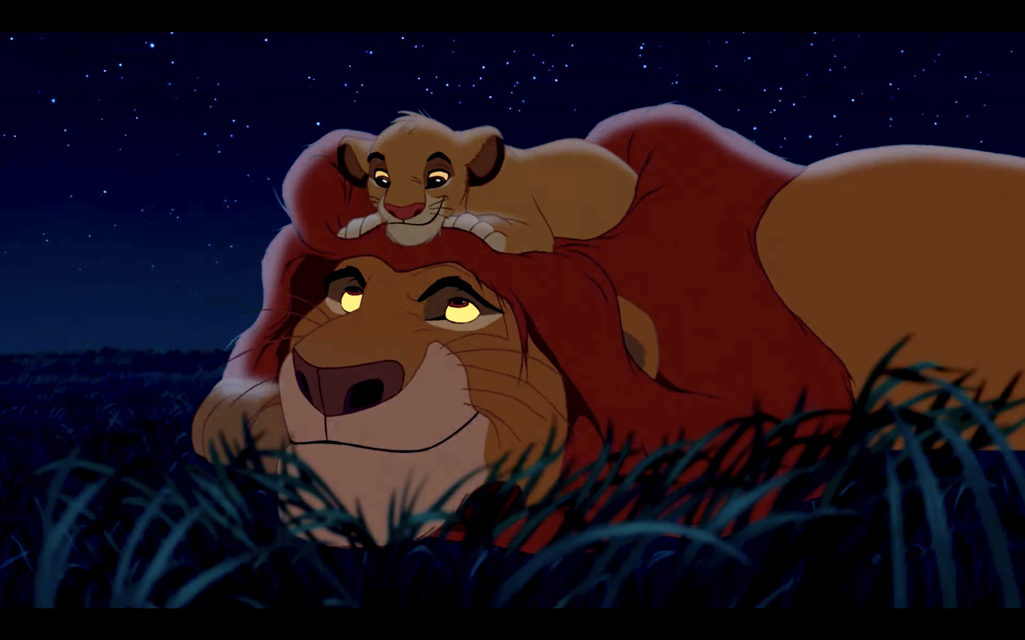 Simba rests on Mufasa's head while stargazing in &quot;The Lion King&quot; at night