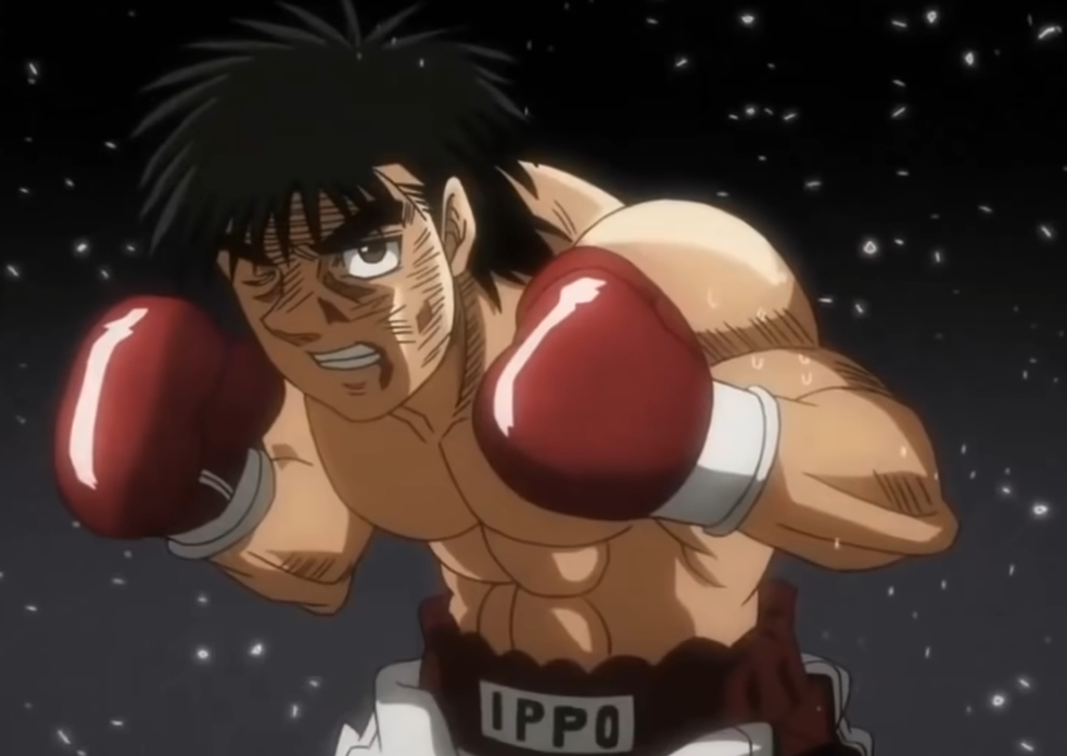 Anime character Ippo Makunouchi, wearing red boxing gloves and shorts, is shown in a boxing stance with a determined expression, in a scene from "Hajime no Ippo"
